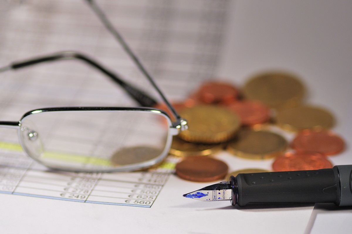 glasses money spreadsheet calculating asking price and investment